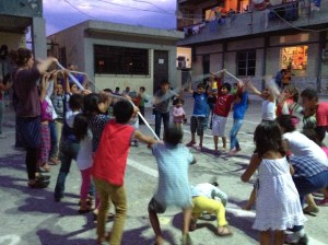 Lorene dances with the children of Lavrio Refugee Camp